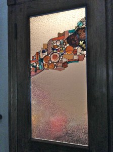 So, the door is restored, with lots of new color and pattern;  that is a good thing.  The lovely old glass is once again sitting in the light, which is also a very good thing!