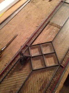 I took each panel out of its frame, cleaned the glass, and mended the solder joints in the zinc matrix.